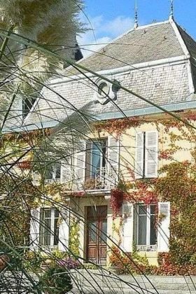 Old Villa Covered in Vines